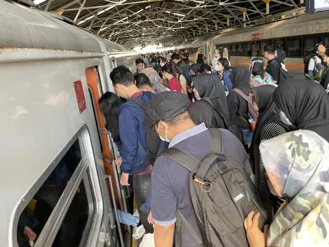 Train passengers will board and enter the train carriage at the station Stock Photos