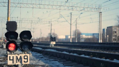 The train passes against the background of a red traffic light, from shadow to l Stock Footage 125136071