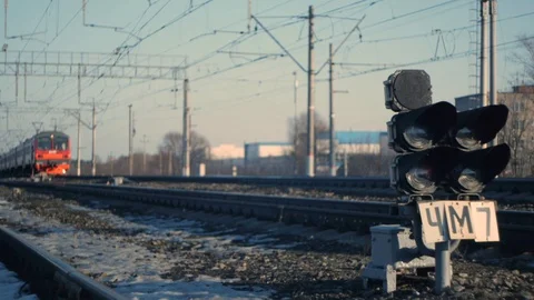 Train passes against the background of a traffic light Stock Footage 125136847