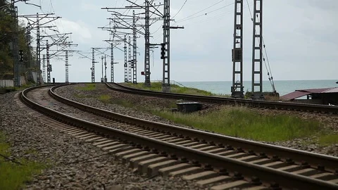 The train passes on the background of the sea Stock Footage 114572773