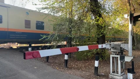 The train passes behind the barrier Stock Footage 233491645