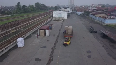 The train passes in the container area Stock Footage 236983966