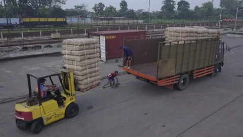 The train passes in the container area Stock Footage 236985348