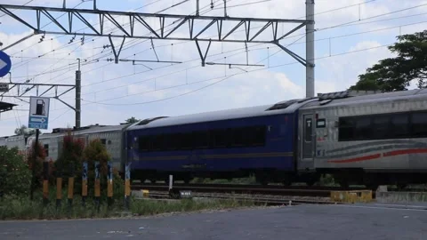 The train passes during the hot day. Footage taken in Java Stock Footage 274996732