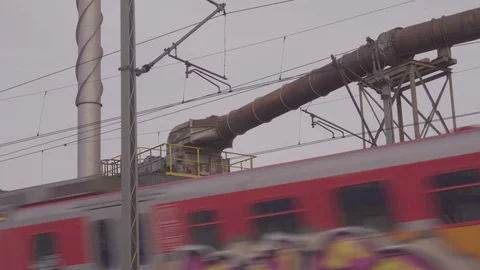 A train passes the factory Stock Footage 88784389