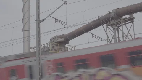 A train passes the factory Stock Footage 88784623