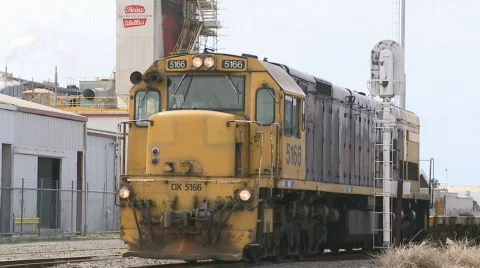 Train passes industrial plant Stock Footage 525978