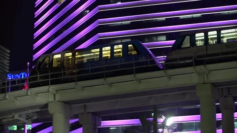 Train Passes Miami Tower Night with Colors Changing Stock Footage 158766484