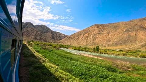 The train passes a mountain river Stock-Footage 282374927