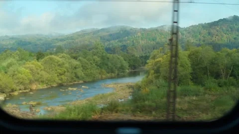 Train passes mountains, valleys and river. Beautiful nature of Ukrainian Stock Footage 263814352