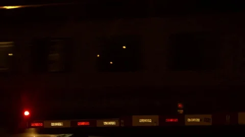 Train passes by at night Stock Footage 79173201