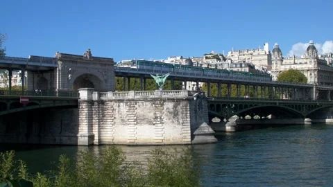Train passes over the Bir Hakeim bridge in Paris on autumn day in Paris. Stock Footage 236389085
