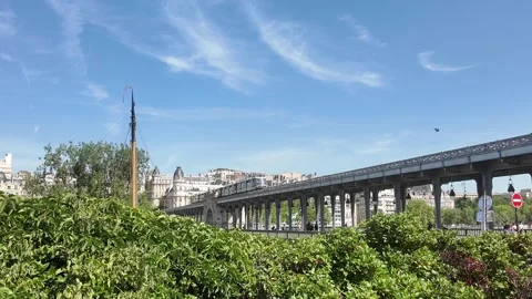 Train passes over Bir Hakeim bridge in paris Stock Footage 297471681