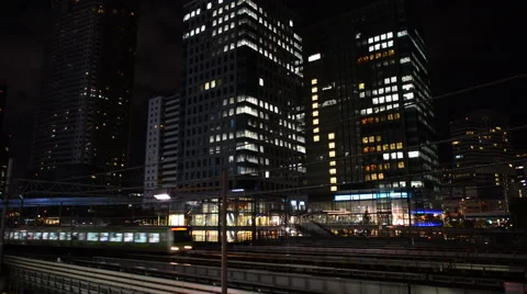 Train Passes over Bridge in Central Tokyo Japan at Night Stock Footage 42975440