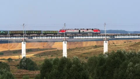 The train passes over the bridge. Stock Footage 276489394