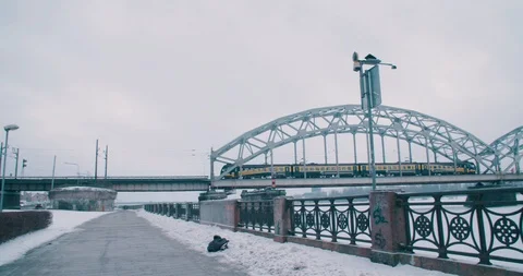 Train passes over Railway Bridge in the Snow - Riga, Latvia (4K) Stock Footage 102262558