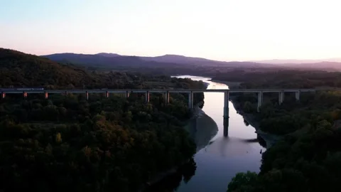 Train passes by Sunset Aerial drone 4k Arno river bridge Tuscany Italy Stock Footage 250094148