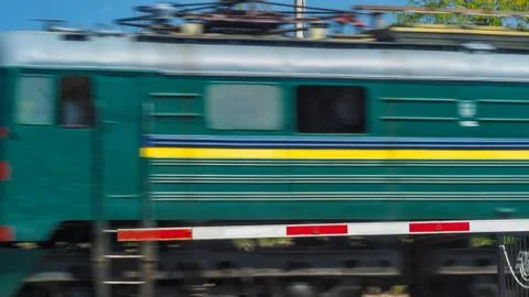 The train passes through the crossing Stock Photos