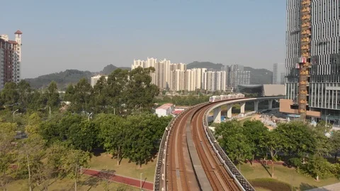 A train passes through a curved subway viaduct towards a drone. Stock Footage 118288326