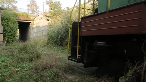 The train passes through a green area Stock Footage 323000980