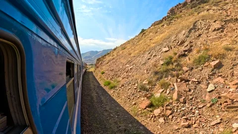 The train passes through the mountains Video stock 282363916