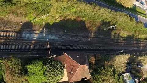 Train passes on the tracks seen from above Stock Footage 128819345