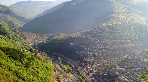 Train passes trough a gorgeous river gorge Stock Footage 21272652