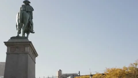 Train passes Washington statue Stock Footage 8995927