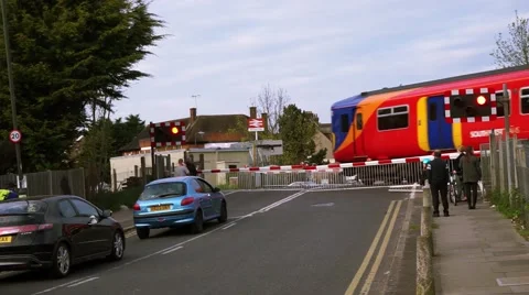 A train passing across a level crossing, London, UK.. Stock Footage 55939556
