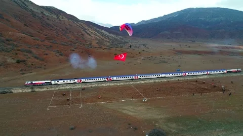 Train Passing and Javelin Throwers Stock Footage 132890153