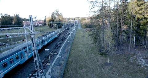Train passing and stops at station in distance 스톡 동영상 163156347