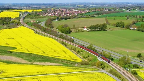Train passing by in beautiful landscape 4K Stock Footage 235449864