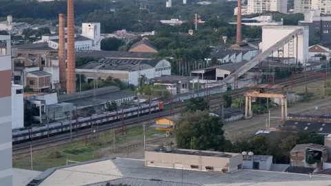A train passing between old factories and warehouses in the Lapa neighborho.. Stock Footage 342195804