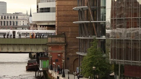 Train passing on bridge in the evening, London Video stock 76385236