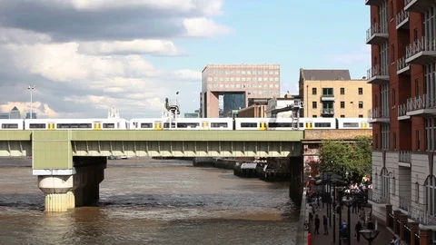Train passing on bridge, London Stock Footage 76384747
