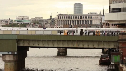 Train passing on bridge, London Video stock 76385169