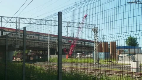 Train passing by on bridge over railways. Land transport. Stock-Footage 135736841