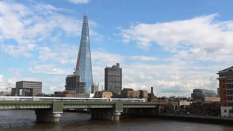 Train passing on bridge with The Shard in background, London Video stock 76384846