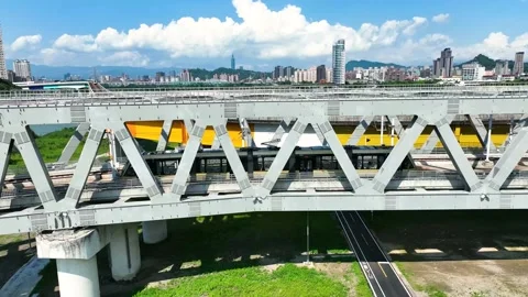 Train passing bridge through urban environment in 101 Taiwan Asia Stock Footage 218347678