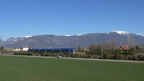 Train passing in a countryside landscape Stock Footage 87739389