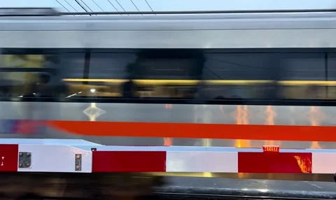 Train passing a crossing Stock Footage 307704130