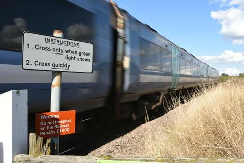 Train passing crossing Stock Photos