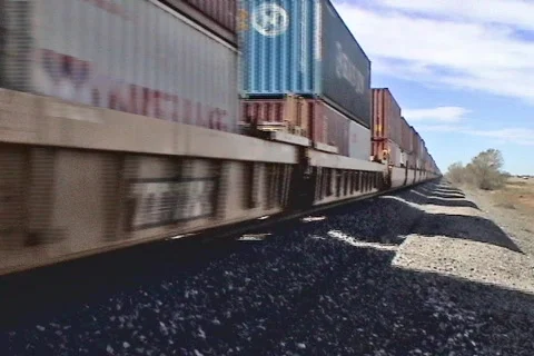 Train passing by in desert Stock Footage 68853