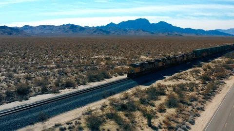 Train Passing By in the Desert Stock Footage 127011189