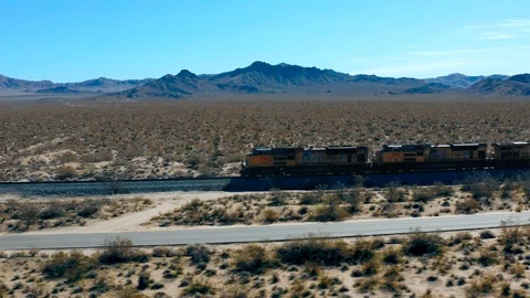 Train Passing By in the Desert Stock Footage 127011355