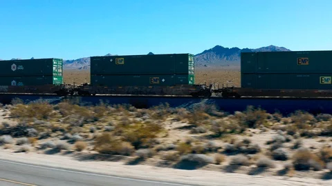 Train Passing By in the Desert Stock Footage 127011361
