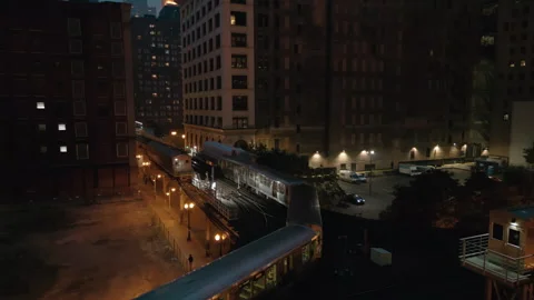 Train passing on Elevated Track at Night. Subway in downtown Chicago Stock Footage 245960952