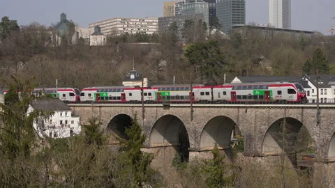 Train passing on a high railway bridge Stock Footage 220875151