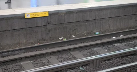Train passing at high speed at the station with a lot of garbage in Paris, Stock Footage 255607968
