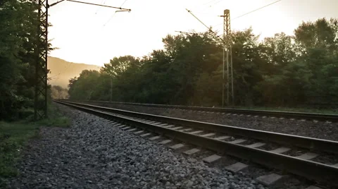 Train passing by, high speed, sunrise, morning Stock Footage 67656402